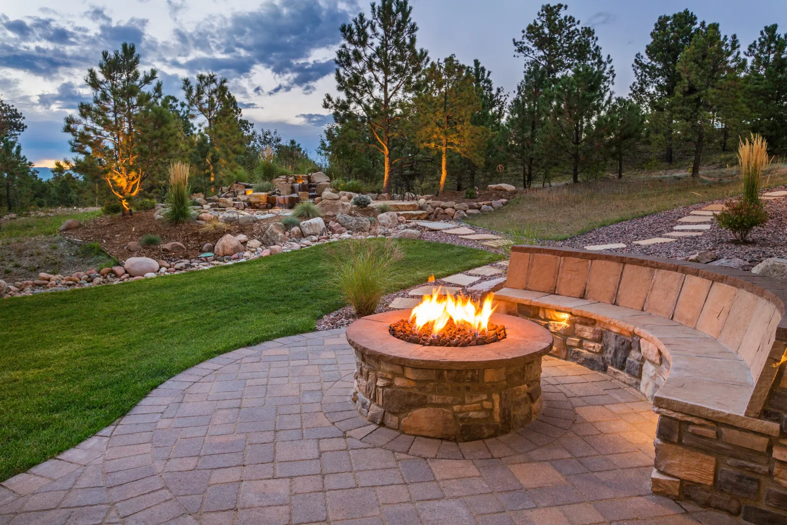 "Residential patio with stone installation for outdoor living remodel and replacement" | Bayside Pavers