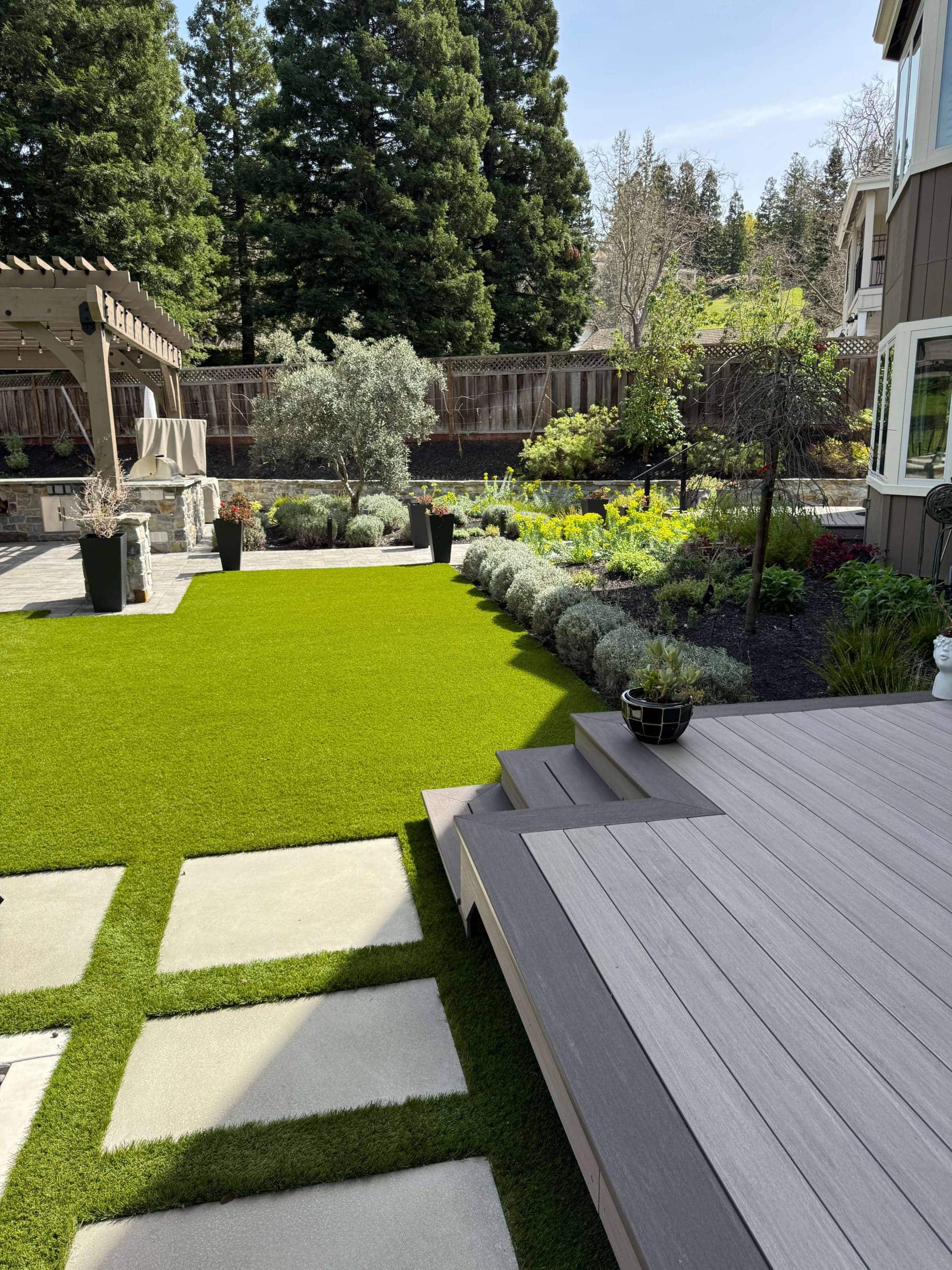 Outdoor living space with pavers and turf